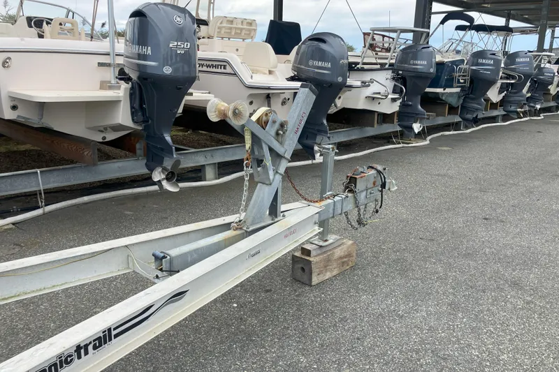 Slide: The Image of Row of boats with Yamaha outboard motors, featuring a 2001 Parker 2520 Sport Cabin. - 42