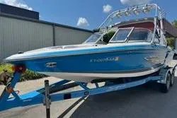 Slide: The Image of 2004 Supra Launch SS boat on trailer, rear view, blue and white design. - 4