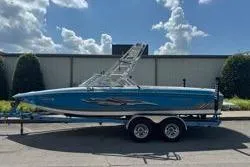 Slide: The Image of Steering wheel and dashboard of a 2004 Supra Launch SS boat. - 5