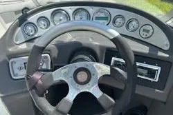 Slide: The Image of 2004 Supra Launch SS boat interior with steering wheel and dashboard controls. - 7