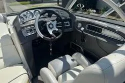 Slide: The Image of 2004 Supra Launch SS boat speakers on a sunny day with blue sky background. - 9