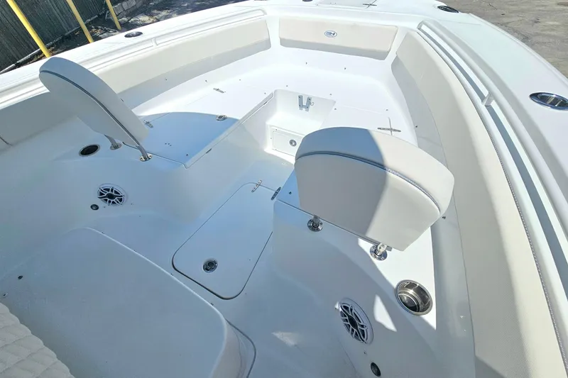 Slide: The Image of 2026 Sea Hunt Ultra 265 SE boat interior with seating and speakers. - 19