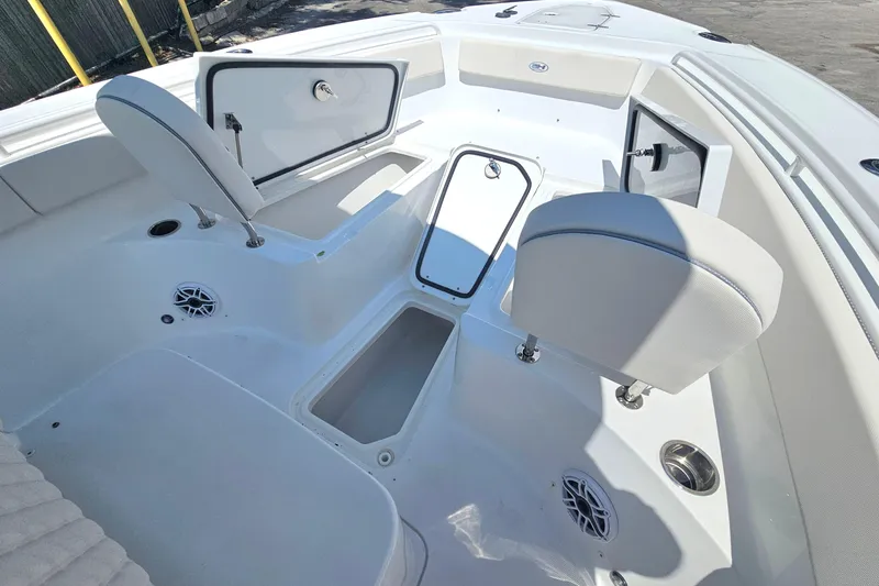 Slide: The Image of 2026 Sea Hunt Ultra 265 SE boat interior with open storage compartments and seating. - 20