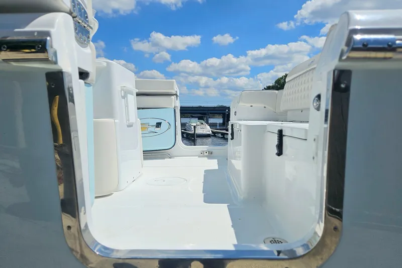 Slide: The Image of 2026 Sea Hunt Ultra 265 SE boat interior with clear sky and water view. - 4