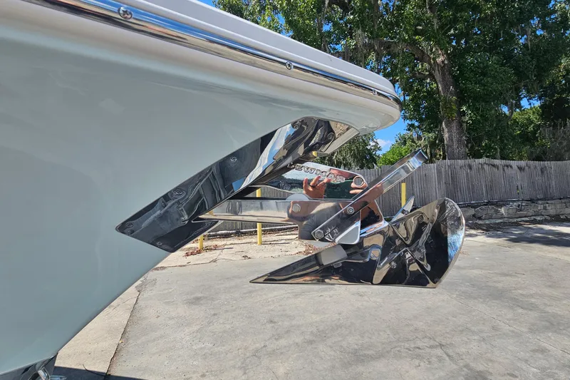 Slide: The Image of 2026 Sea Hunt Ultra 265 SE boat anchor detail with reflective chrome finish. - 7