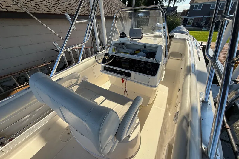 Slide: The Image of 1995 Wellcraft Scarab Sport 302 boat interior with steering console and seating. - 5