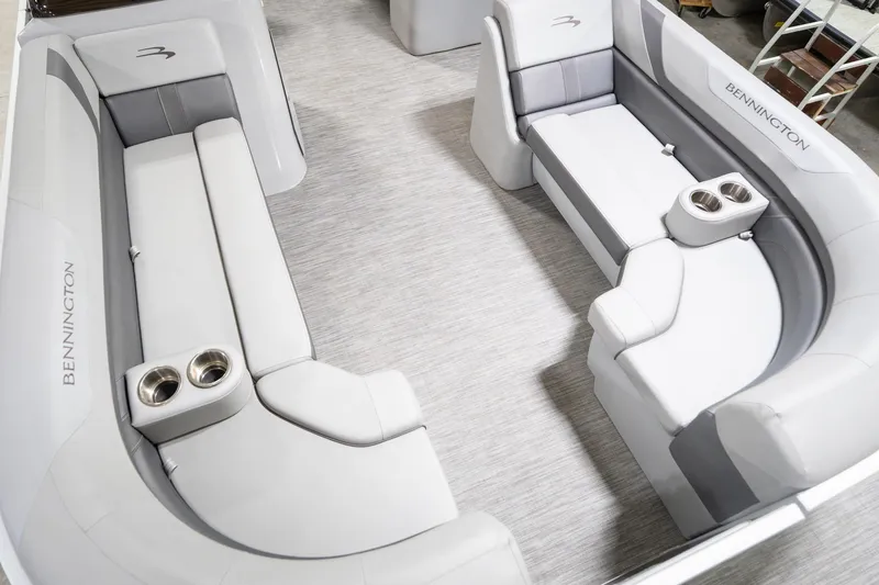 Slide: The Image of 2021 Bennington 21 SLX boat interior with gray seating and cup holders. - 13