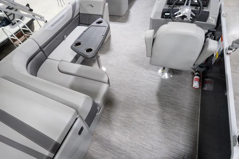 Slide: The Image of Luxurious interior of 2021 Bennington 21 SLX pontoon boat with plush seating and cup holders. - 14