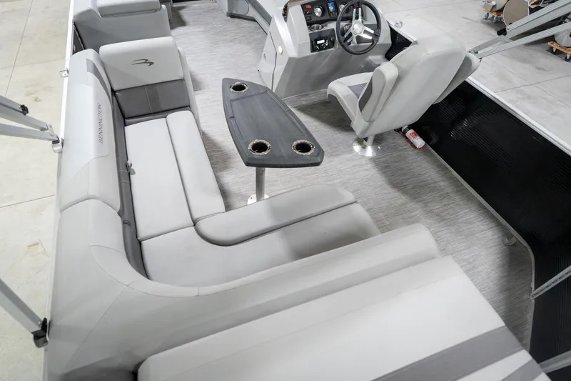 Slide: The Image of Interior of a 2021 Bennington 21 SLX pontoon boat with gray seating and steering console. - 15