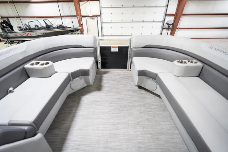 Slide: The Image of 2021 Bennington 21 SLX pontoon boat interior with modern dashboard and seating. - 21