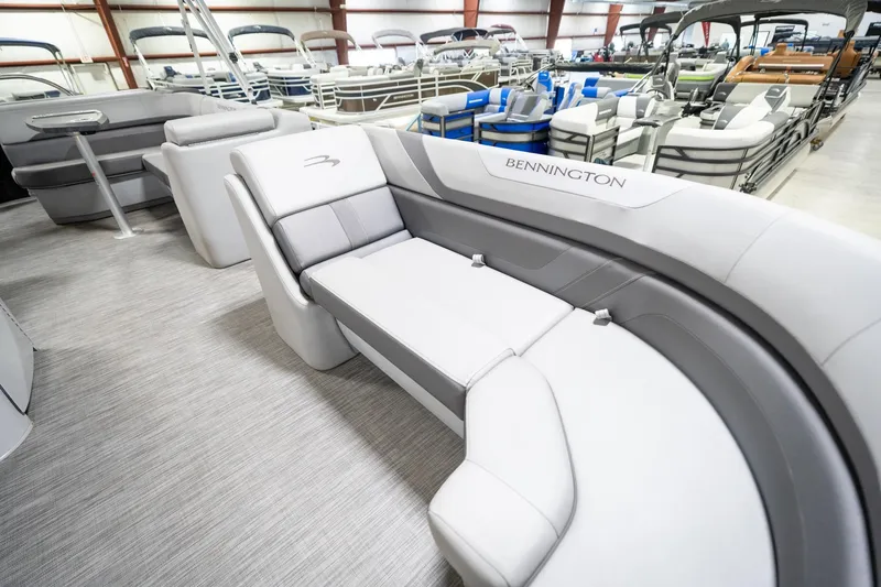 Slide: The Image of 2021 Bennington 21 SLX pontoon boat interior with plush seating and cup holders. - 23