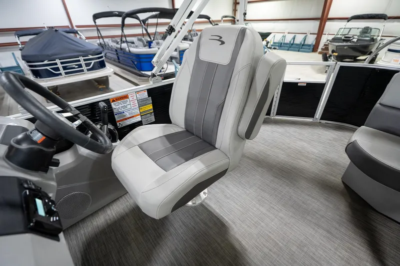 Slide: The Image of 2021 Bennington 21 SLX pontoon boat interior with gray seating, showcased at Reeder-Trausch Marine. - 26