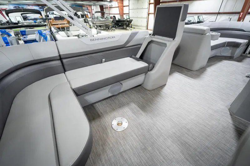 Slide: The Image of Interior of 2021 Bennington 21 SLX pontoon boat with gray seating and flooring. - 30