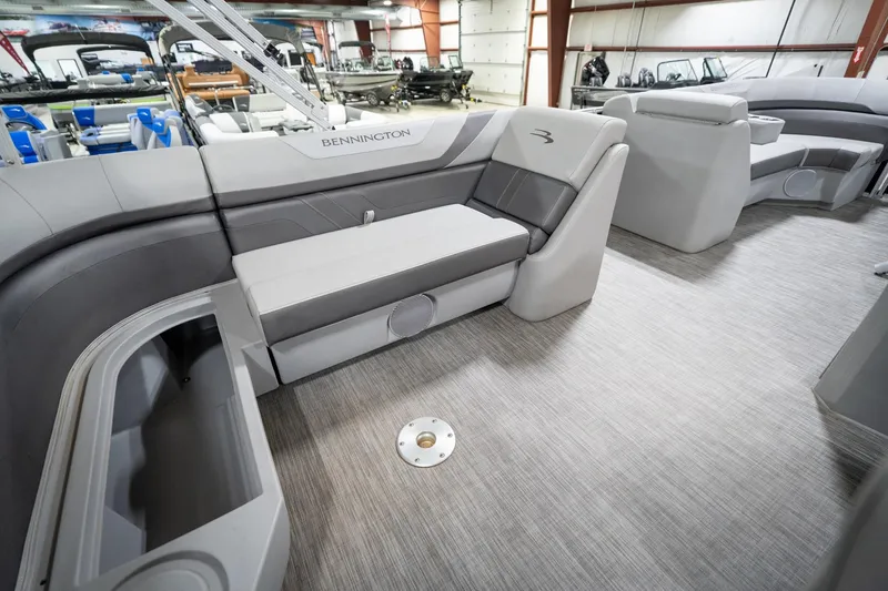 Slide: The Image of 2021 Bennington 21 SLX pontoon boat interior with gray seating and flooring. - 31