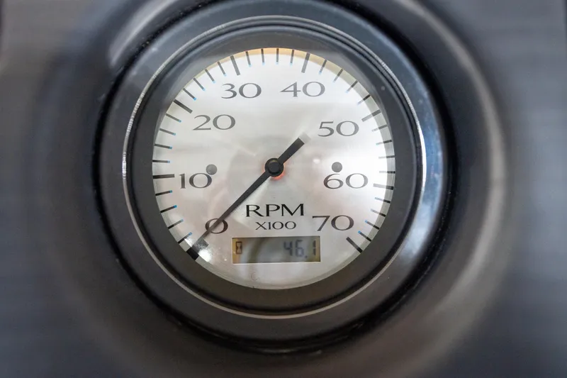 Slide: The Image of Dashboard controls of a 2021 Bennington 21 SLX boat, featuring switches and a gauge. - 38