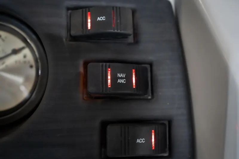 Slide: The Image of Instrument panel of 2021 Bennington 21 SLX boat showing volt, fuel, and trim gauges. - 41