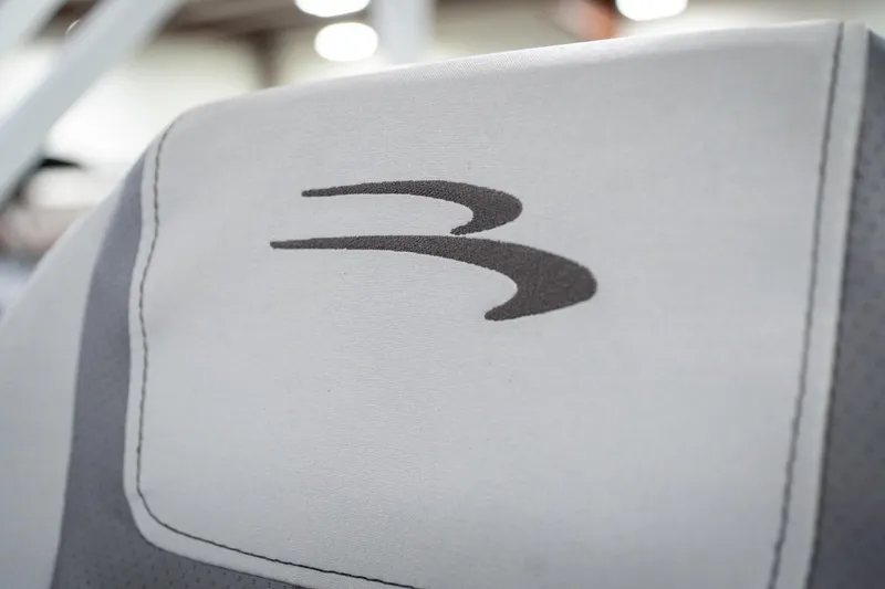 Slide: The Image of Captain's chair in 2021 Bennington 21 SLX pontoon boat, showcased indoors. - 44