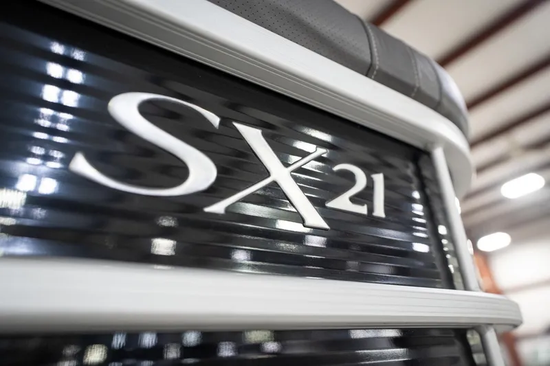 Slide: The Image of 2021 Bennington 21 SLX boat logo with Reeder-Trausch Marine contact details. - 58