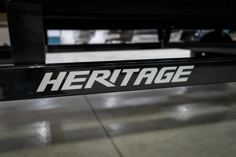 Slide: The Image of Trailer hitch and wheel assembly for 2021 Bennington 21 SLX in a showroom. - 60