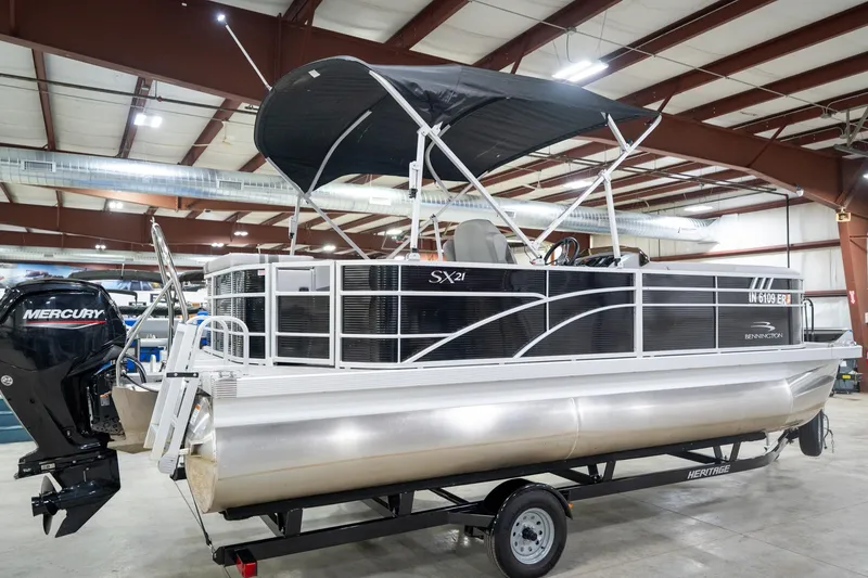 Slide: The Image of 2021 Bennington 21 SLX pontoon boat on trailer in indoor showroom. - 8