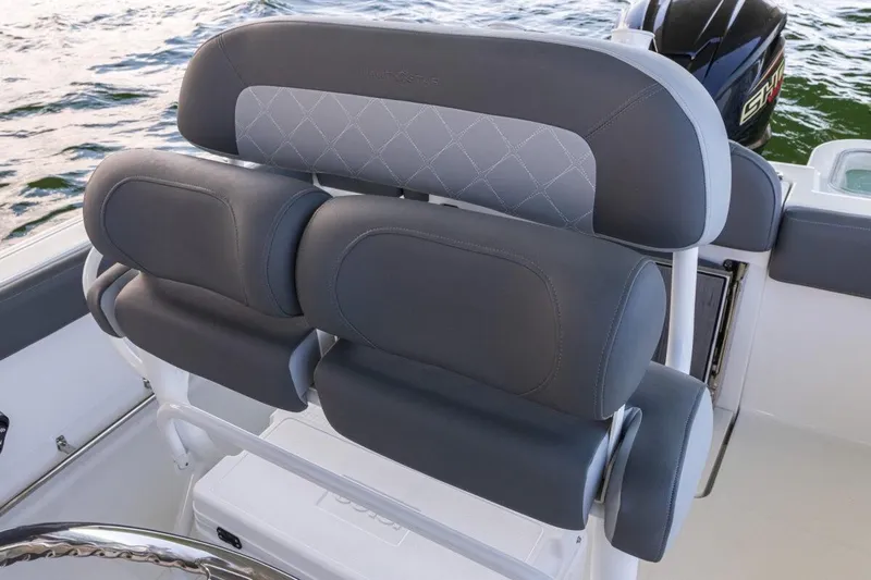 Slide: The Image of 2026 NauticStar 251 Hybrid boat seating with gray upholstery and diamond stitching. - 11