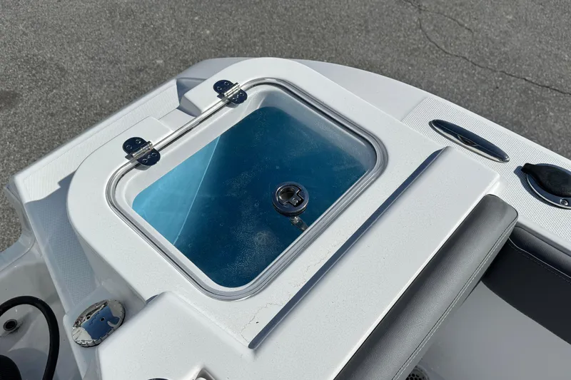 Slide: The Image of Livewell on 2026 NauticStar 242 Offshore boat, featuring a secure latch and sleek design. - 15