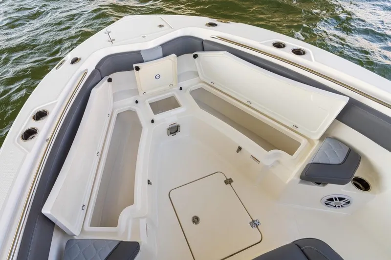 Slide: The Image of 2026 NauticStar 251 Hybrid boat interior with seating and storage compartments. - 7
