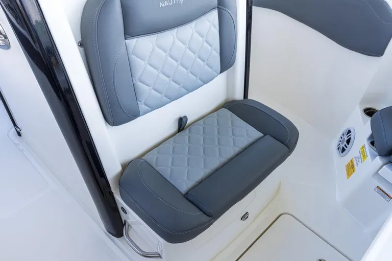 Slide: The Image of 2026 NauticStar 251 Hybrid boat seat with quilted gray upholstery. - 8