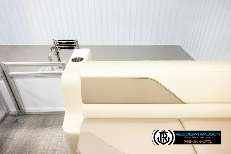 Slide: The Image of 2026 Avalon VEN CRB boat interior with beige seating and cup holder. - 15