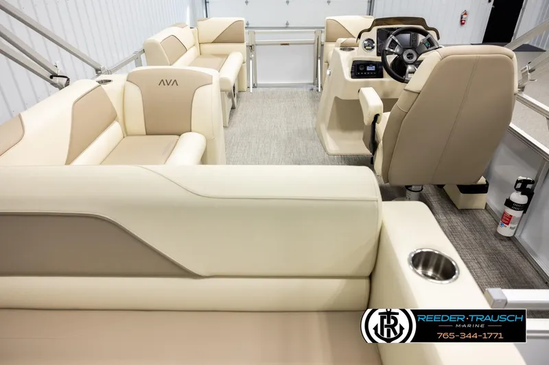 Slide: The Image of 2026 Avalon VEN CRB boat interior with beige seating and modern helm controls. - 16