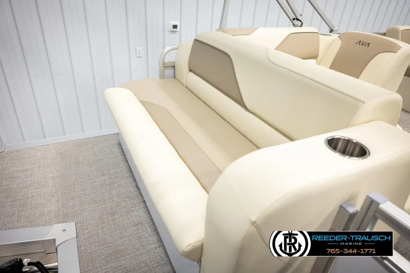 Slide: The Image of Luxurious seating in 2026 Avalon VEN CRB boat with beige upholstery and cup holder. - 22