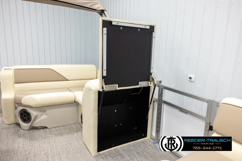 Slide: The Image of 2026 Avalon VEN CRB boat interior with beige seating and storage compartment. - 25