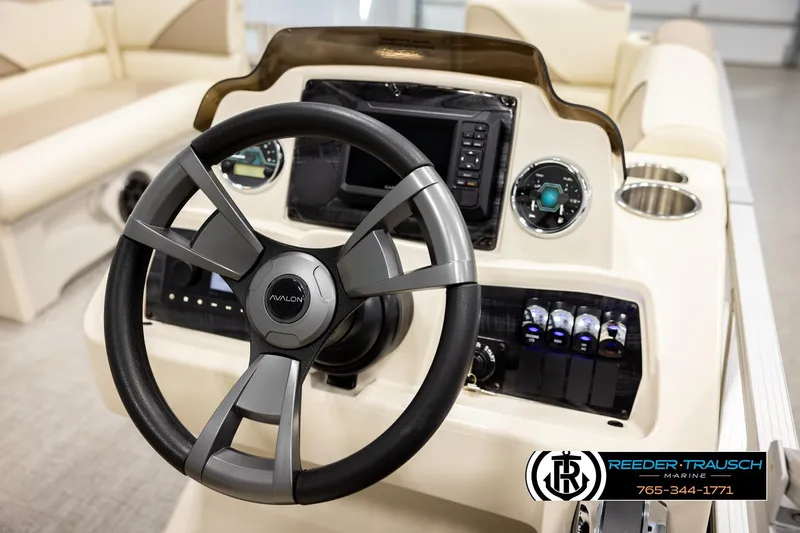 Slide: The Image of 2026 Avalon VEN CRB boat dashboard with steering wheel and control panel. - 26