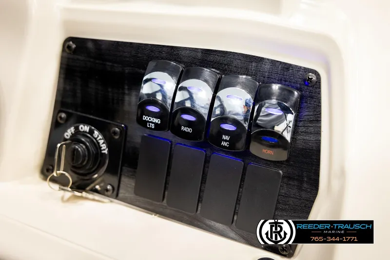 Slide: The Image of Control panel of 2026 Avalon VEN CRB boat with labeled switches and ignition key. - 33