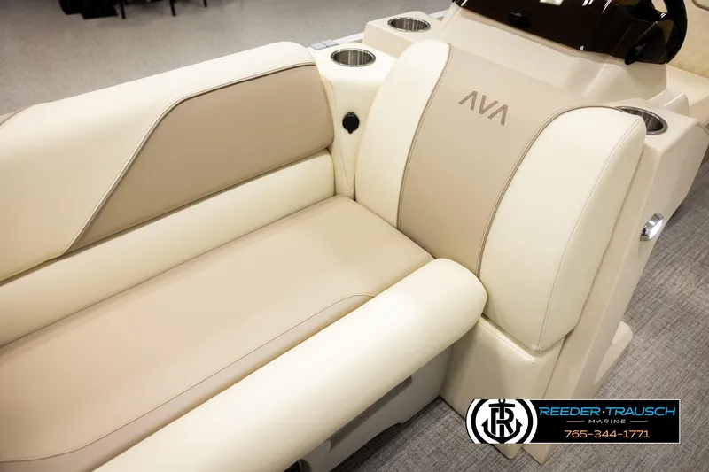 Slide: The Image of Luxurious 2026 Avalon VEN CRB boat seating with beige upholstery and cup holders. - 36