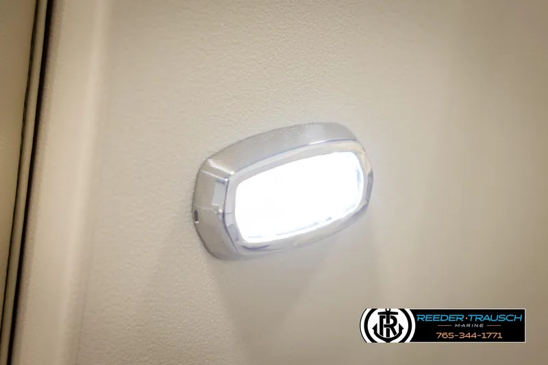 Slide: The Image of LED light on 2026 Avalon VEN CRB boat interior wall, Reeder-Trausch Marine logo visible. - 39