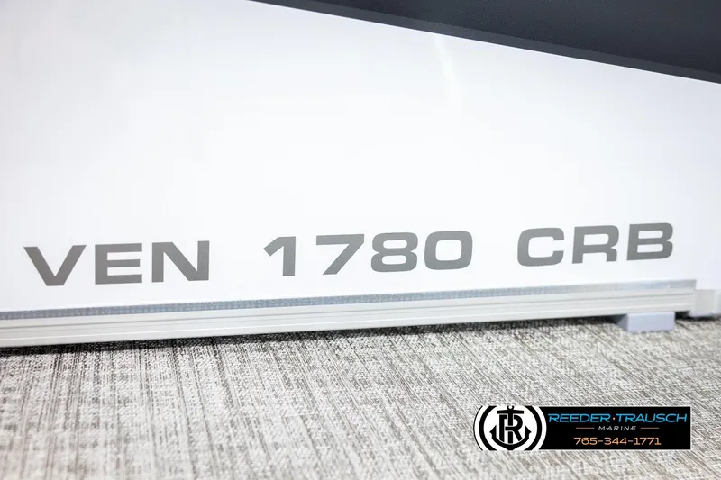 Slide: The Image of 2026 Avalon VEN CRB boat model detail with Reeder-Trausch Marine branding. - 44
