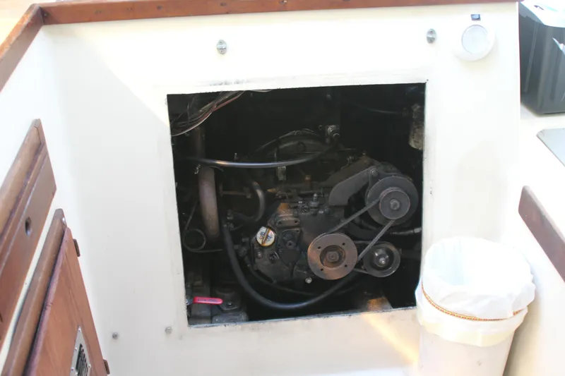 Slide: The Image of Engine compartment of a 1980 Watkins MONOHULL sailboat, showcasing mechanical components. - 17