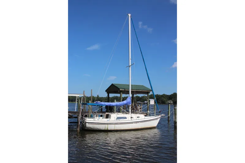 Slide: The Image of 1980 Watkins MONOHULL sailboat docked on a sunny day. - 23