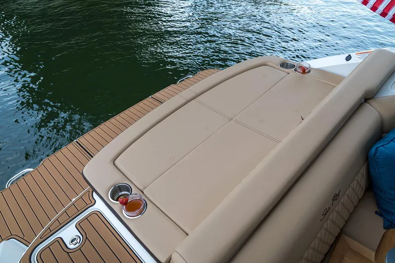 Slide: The Image of 2020 Sea Ray SLX 250 boat interior with tan seating and modern design. - 12