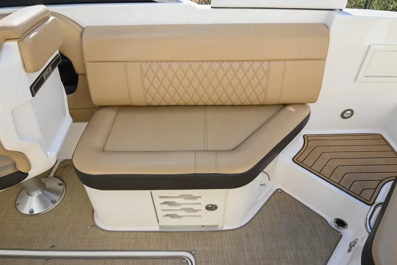 Slide: The Image of 2020 Sea Ray SLX 250 boat interior with tan leather seating and elegant design. - 16