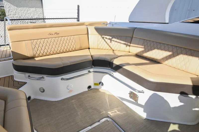 Slide: The Image of Luxurious seating area on a 2020 Sea Ray SLX 250 boat with tan upholstery. - 17
