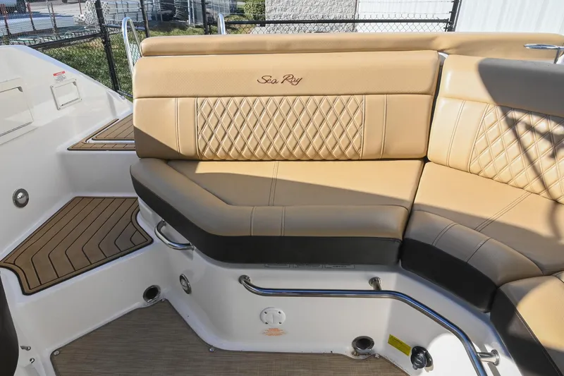 Slide: The Image of 2020 Sea Ray SLX 250 boat interior with tan leather seating and diamond stitching. - 19