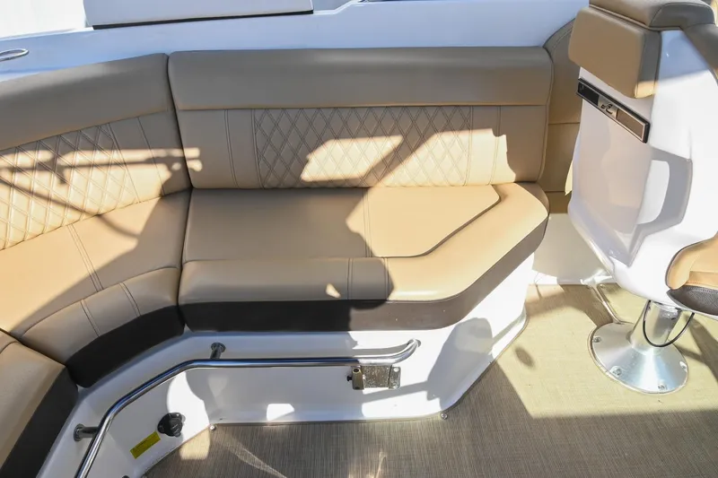 Slide: The Image of 2020 Sea Ray SLX 250 boat interior with tan leather seating and modern design. - 21