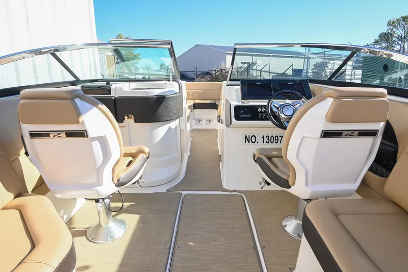 Slide: The Image of Interior of 2020 Sea Ray SLX 250 boat with beige seating and modern dashboard. - 22