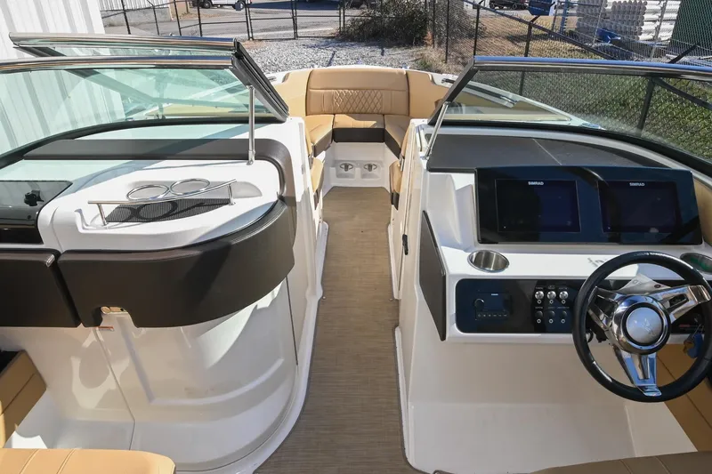 Slide: The Image of 2020 Sea Ray SLX 250 boat interior with modern dashboard and seating. - 28
