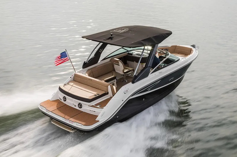Slide: The Image of 2020 Sea Ray SLX 250 boat interior with tan seating and blue canopy. - 3