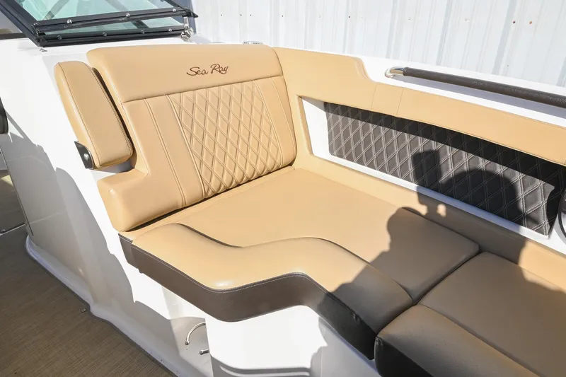 Slide: The Image of Luxurious tan seating on 2020 Sea Ray SLX 250 boat, featuring diamond stitching. - 32