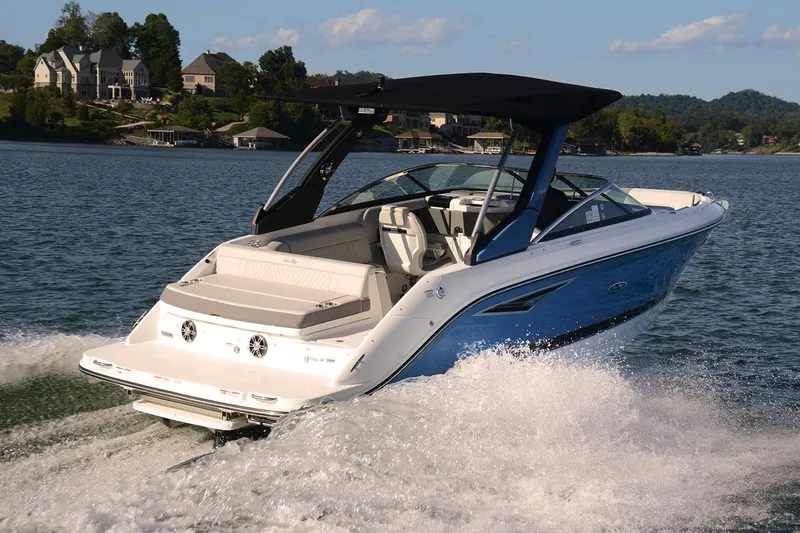 Slide: The Image of 2020 Sea Ray SLX 250 boat on trailer, parked outside a building. - 4