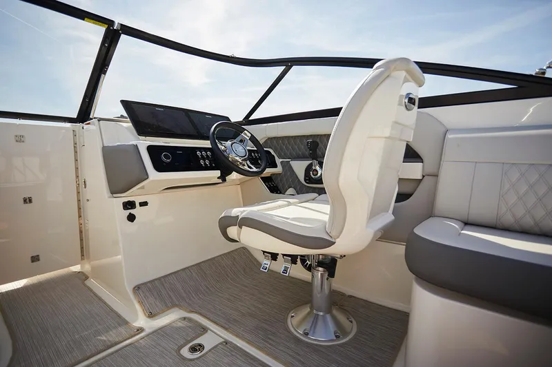 Slide: The Image of 2020 Sea Ray SLX 250 boat with teak-style decking and stainless steel railing. - 8